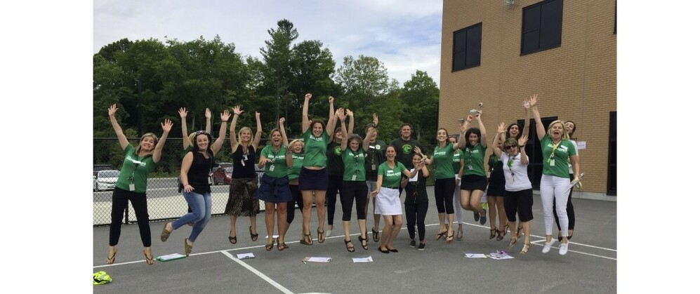 Photo of staff jumping
